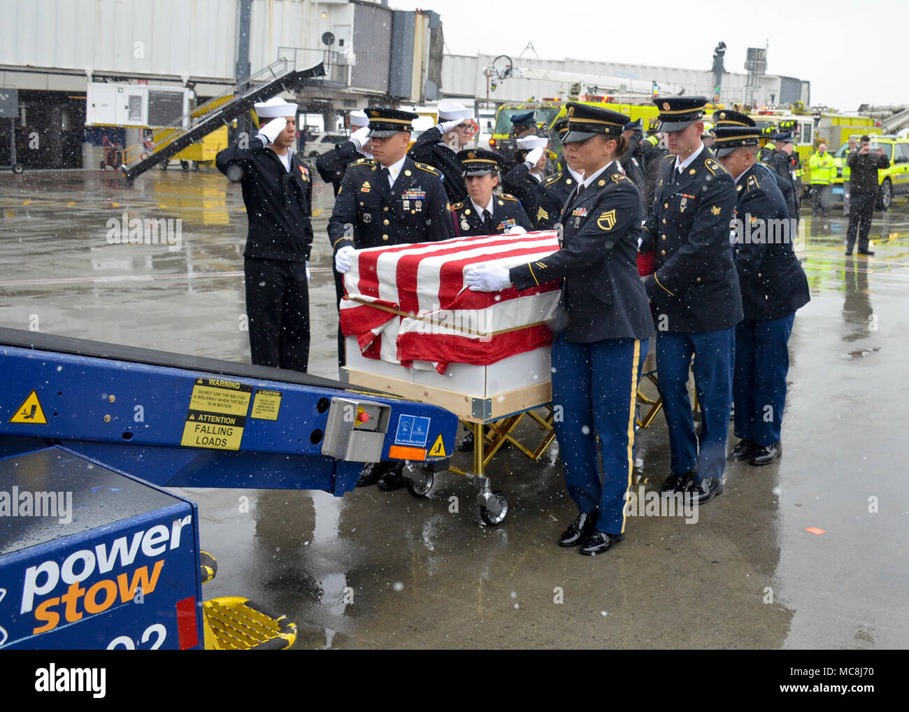 BOSTON (Apr. 2, 2018) The Military Funeral Honors Team of the Massachusetts Army National Guard load the casket of Medal of Honor Recipient Capt. Thomas J. Hudner, Jr., USN, onto a plane for transport to Arlington National Cemetery for his final internment. Capt. Hudner, a naval aviator, received the Medal of Honor for his actions during the Battle of the Chosin Reservoir during the Korean War. Stock Photo