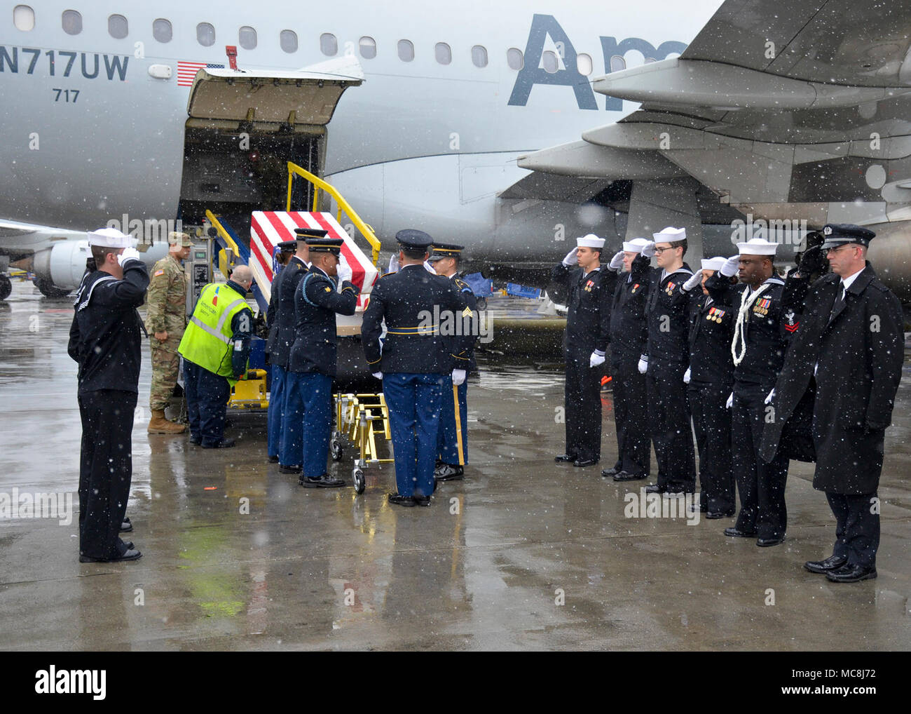 BOSTON (Apr. 2, 2018) The Military Funeral Honors Team of the Massachusetts Army National Guard load the casket of Medal of Honor Recipient Capt. Thomas J. Hudner, Jr., USN, onto a plane for transport to Arlington National Cemetery for his final internment. Capt. Hudner, a naval aviator, received the Medal of Honor for his actions during the Battle of the Chosin Reservoir during the Korean War. Stock Photo