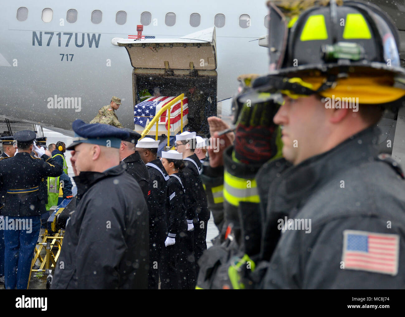 BOSTON (Apr. 2, 2018) The Military Funeral Honors Team of the Massachusetts Army National Guard load the casket of Medal of Honor Recipient Capt. Thomas J. Hudner, Jr., USN, onto a plane for transport to Arlington National Cemetery for his final internment. Capt. Hudner, a naval aviator, received the Medal of Honor for his actions during the Battle of the Chosin Reservoir during the Korean War. Stock Photo