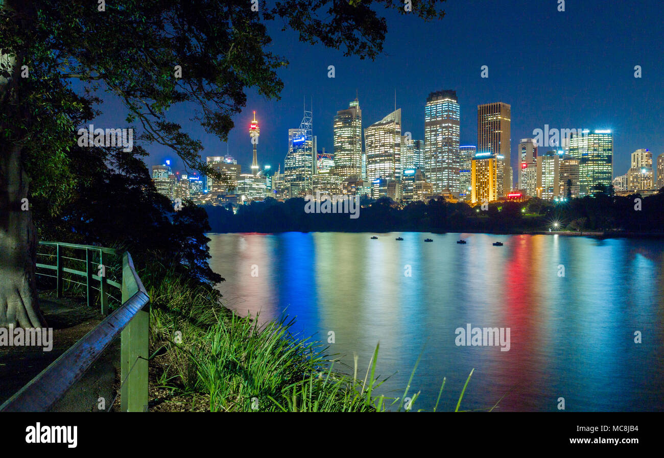 The Sydney city skyline seen across Farm Cove at Mrs Macquarie's Point in Sydney, Australia. Stock Photo