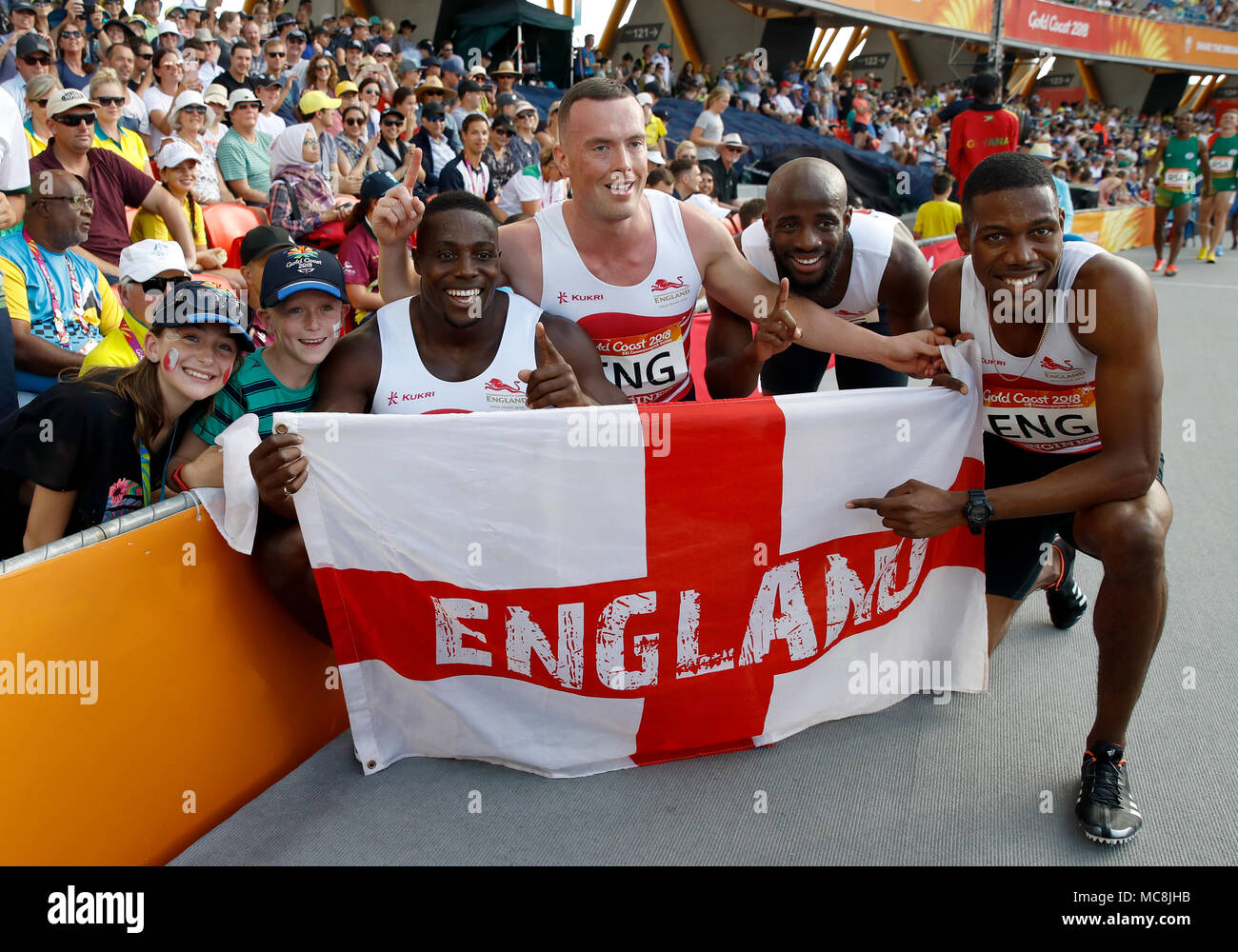 England's (left-right) Harry Aikines-Aryeetey, Richard Kilty, Reuben Arthur and Zharnel Hughes celebrate taking gold in the Men's 4x100m Final at the Carrara Stadium during day ten of the 2018 Commonwealth Games in the Gold Coast, Australia. Stock Photo
