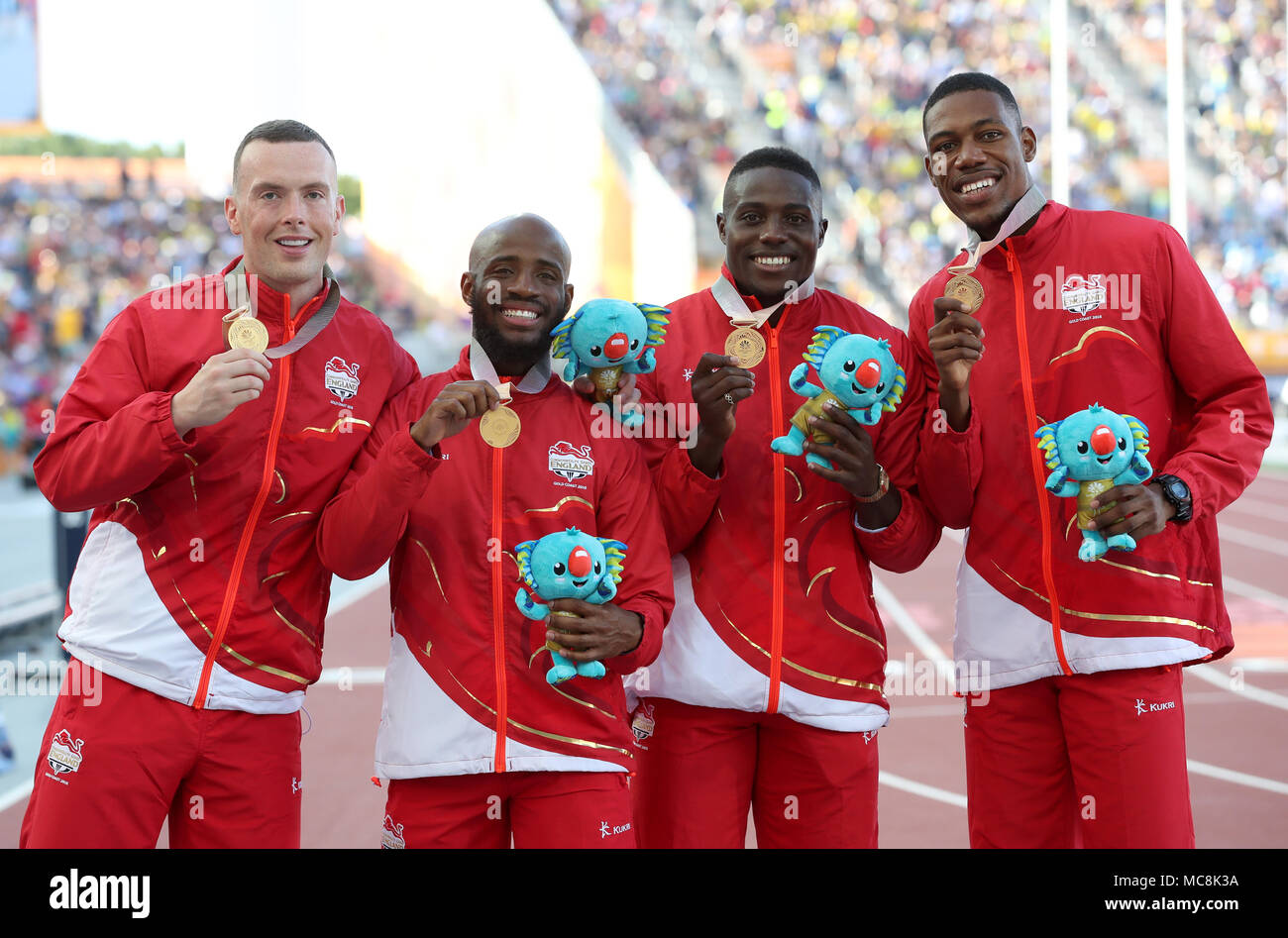 England's (left-right) Richard Kilty, Reuben Arthur Harry Aikines-Aryeety and Zharnel Hughes with the gold in the Men's 4x100m Final at the Carrara Stadium during day ten of the 2018 Commonwealth Games in the Gold Coast, Australia. Stock Photo