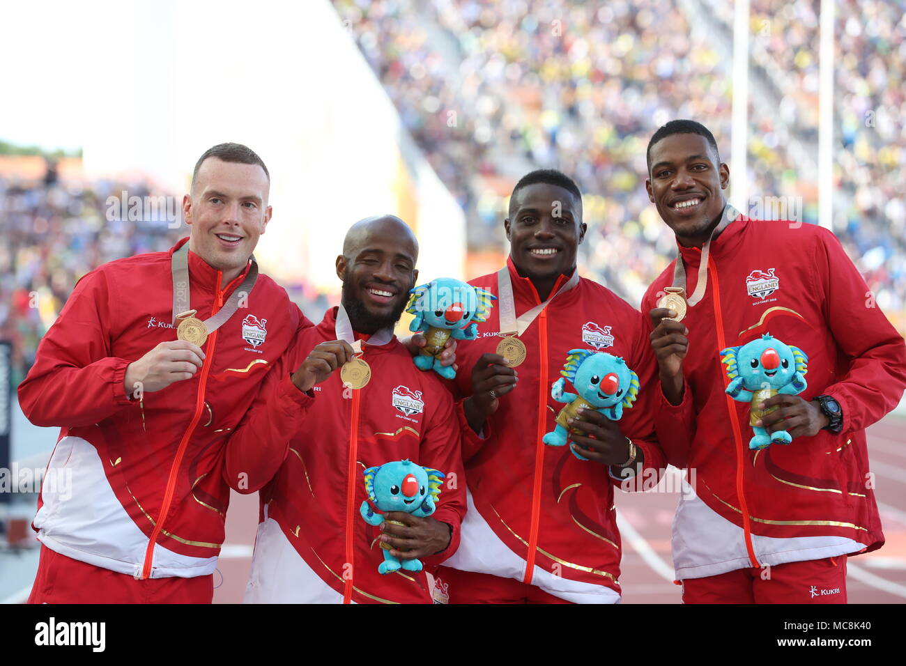 England's (left-right) Richard Kilty, Reuben Arthur Harry Aikines-Aryeety and Zharnel Hughes with the gold in the Men's 4x100m Final at the Carrara Stadium during day ten of the 2018 Commonwealth Games in the Gold Coast, Australia. Stock Photo