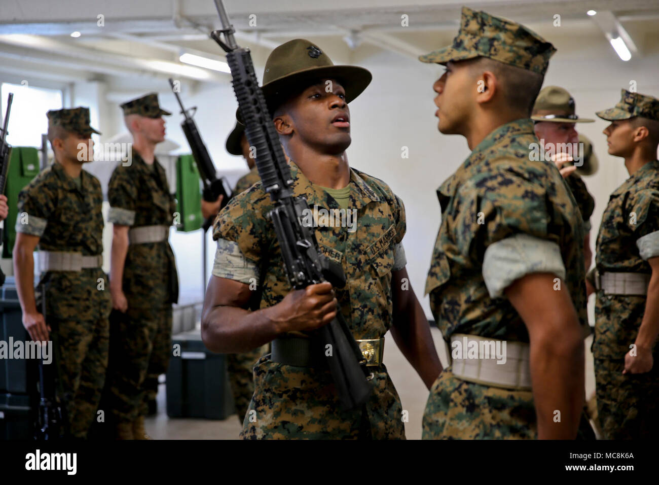 A drill instructor with Delta Company, 1st Recruit Training Battalion, quizzes a recruit during a senior drill instructor inspection at Marine Corps Recruit Depot San Diego, March 29. Drill instructors test recruits to see how much knowledge they’ve retained thus far in recruit training. Recruits take part in a series of classes to learn about such things as the history of the Marine Corps and uniform standards. Annually, more than 17,000 males recruited from the Western Recruiting Region are trained at MCRD San Diego. Delta Company is scheduled to graduate June 1. Stock Photo