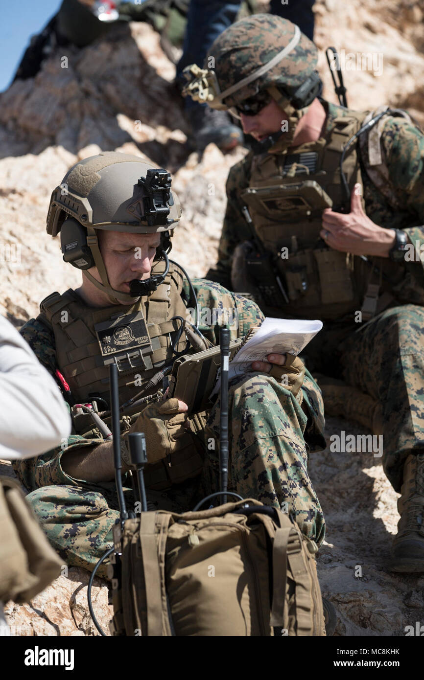 U.S. Marine Maj. Eben Buxton, a MAWTS-1 Air Officer Instructor prepares to set targets for Digitally Aided Close Air Support mission at Chocolate Mountain Training Area, Calif. March 30. WTI is a seven-week training event hosted by Marine Aviation Weapons and Tactics Squadron 1 cadre, which emphasizes operational integration of the six functions of Marine Corps aviation in support of a Marine Air Ground Task Force and provides standardized advanced tactical training and certification of unit instructor qualifications to support Marine Aviation Training and Readiness and assists in developing a Stock Photo