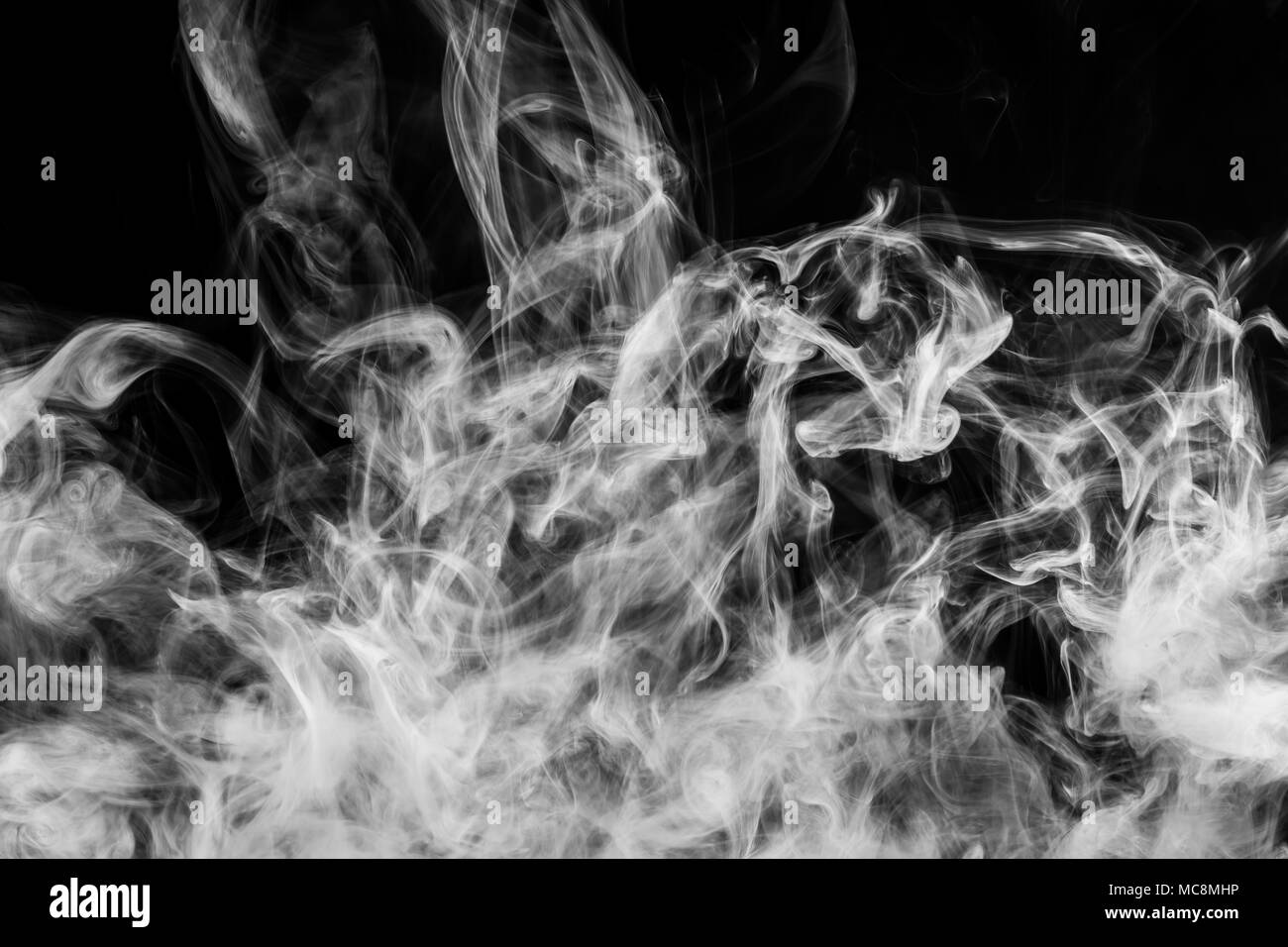 White cloud smoke on black isolated background Stock Photo - Alamy
