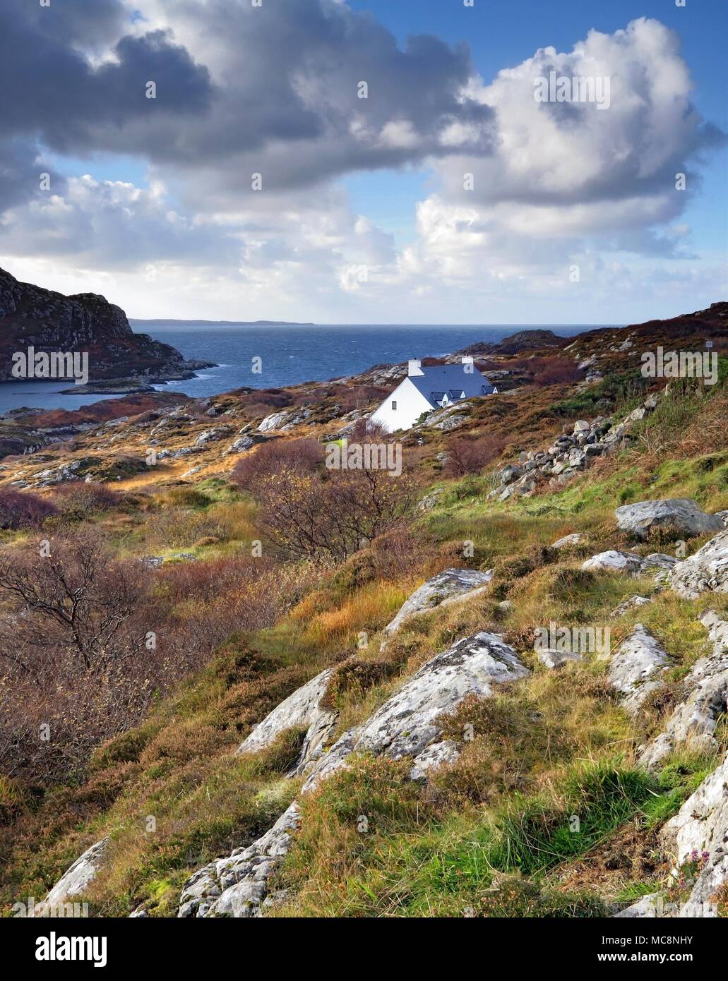 A view across a rugged landscape towards Loch Roe in the Scottish Highlands. Stock Photo