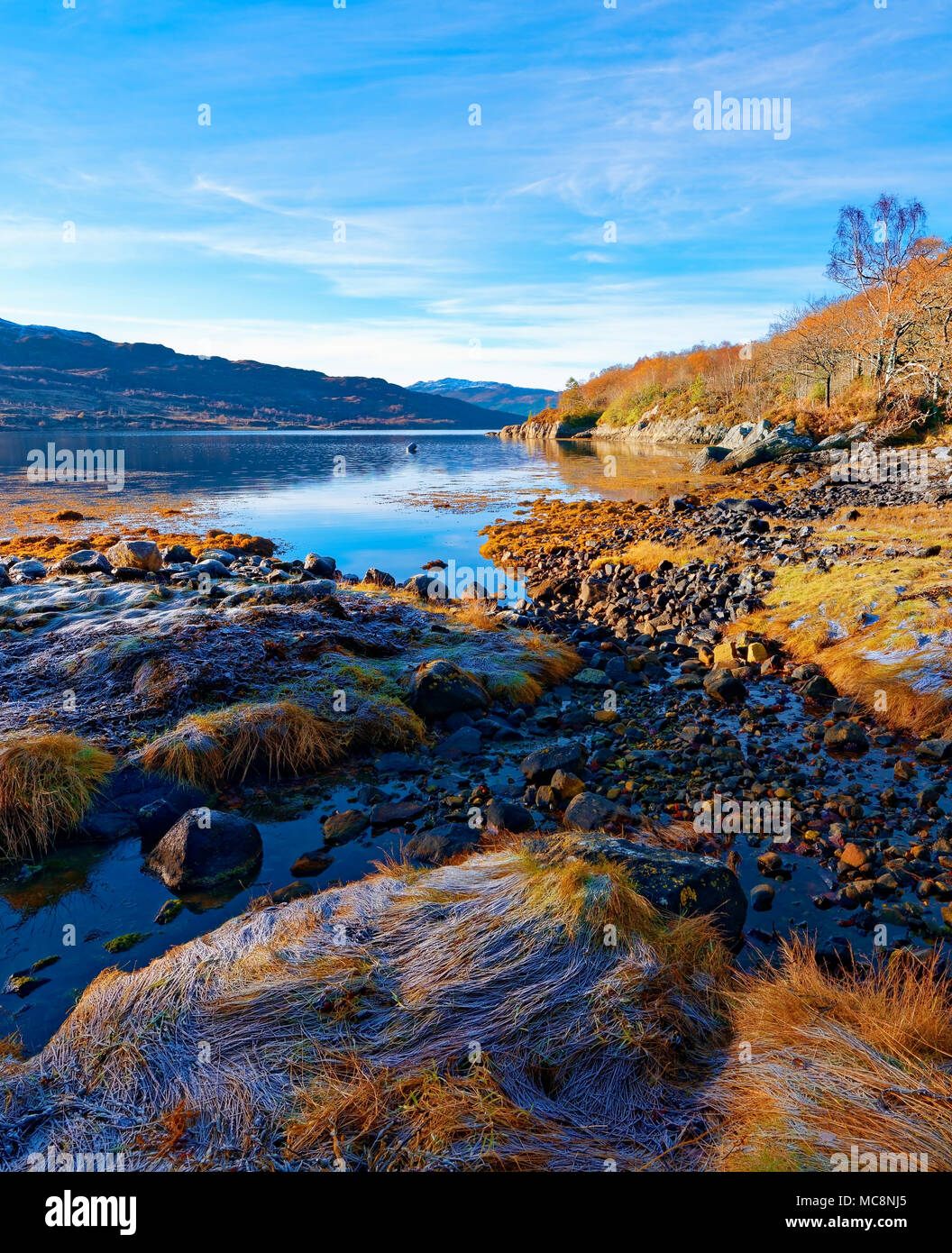 A sunny, autumn view of Loch Sunart in the Scottish Highlands as the first signs of winter appear. Stock Photo