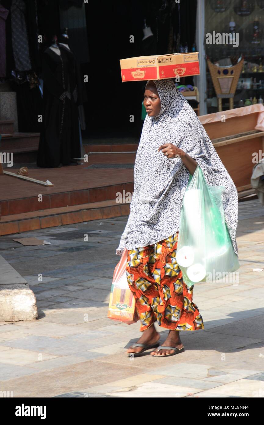 A Woman returning from the Market in Jeddah's Al-Balad District Stock Photo
