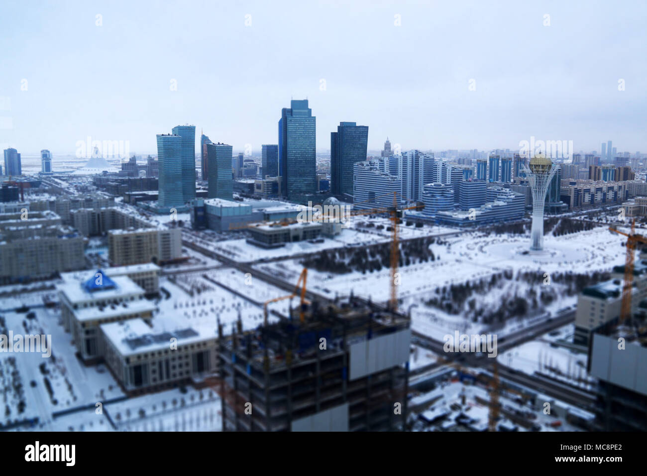 The Capital's skyline, the Bayterek Tower and the Khan Shatyr Entertainment Center: Astana, Kazakhstan, at -24 degrees Celsius Stock Photo