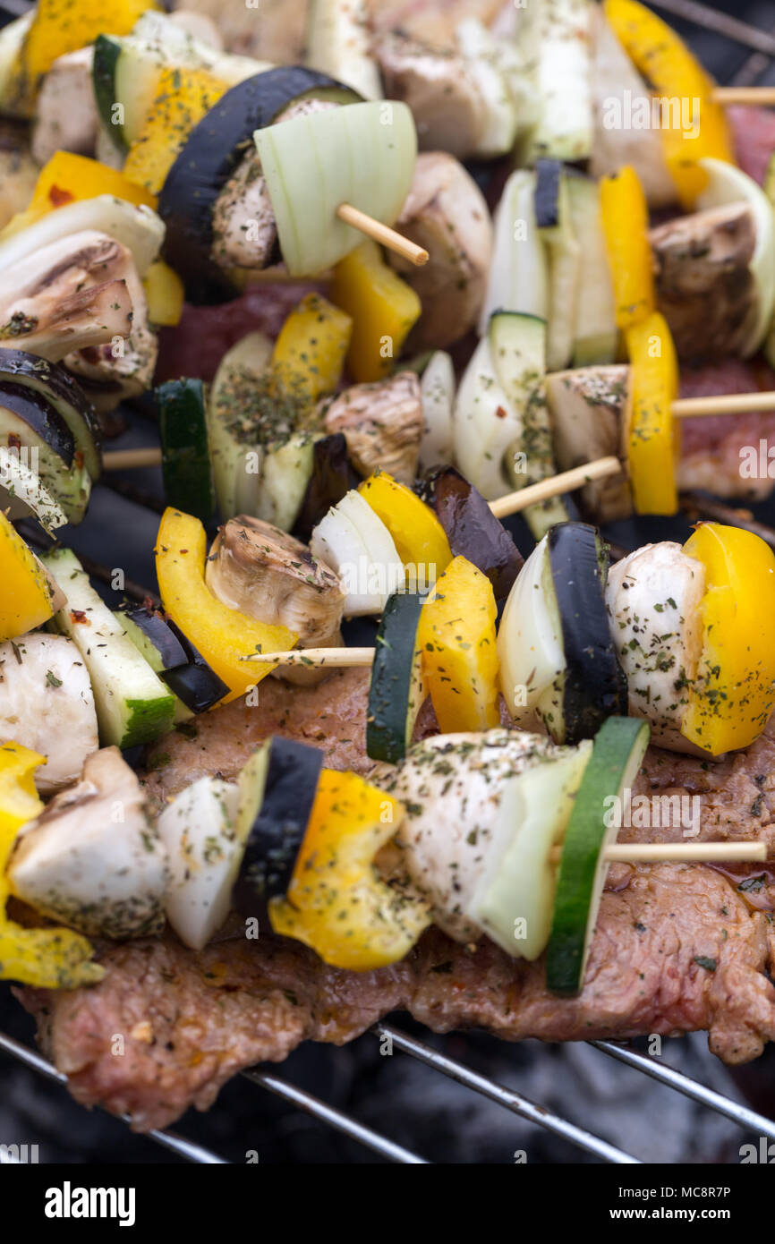 barbecue with delicious grilled meat and vegetables on grill Stock ...