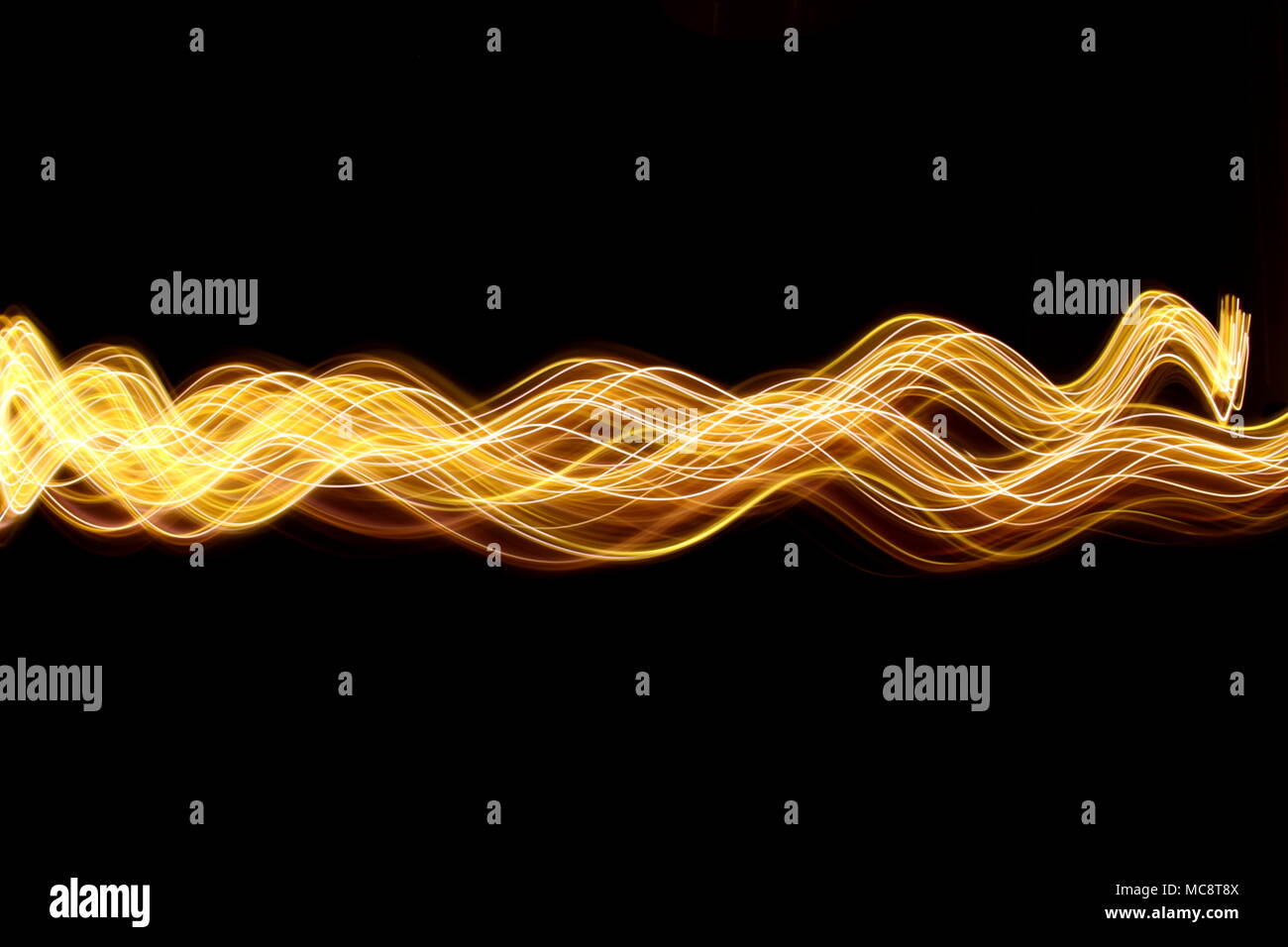 Gold light painting photography, long exposure photo of gold fairy ...