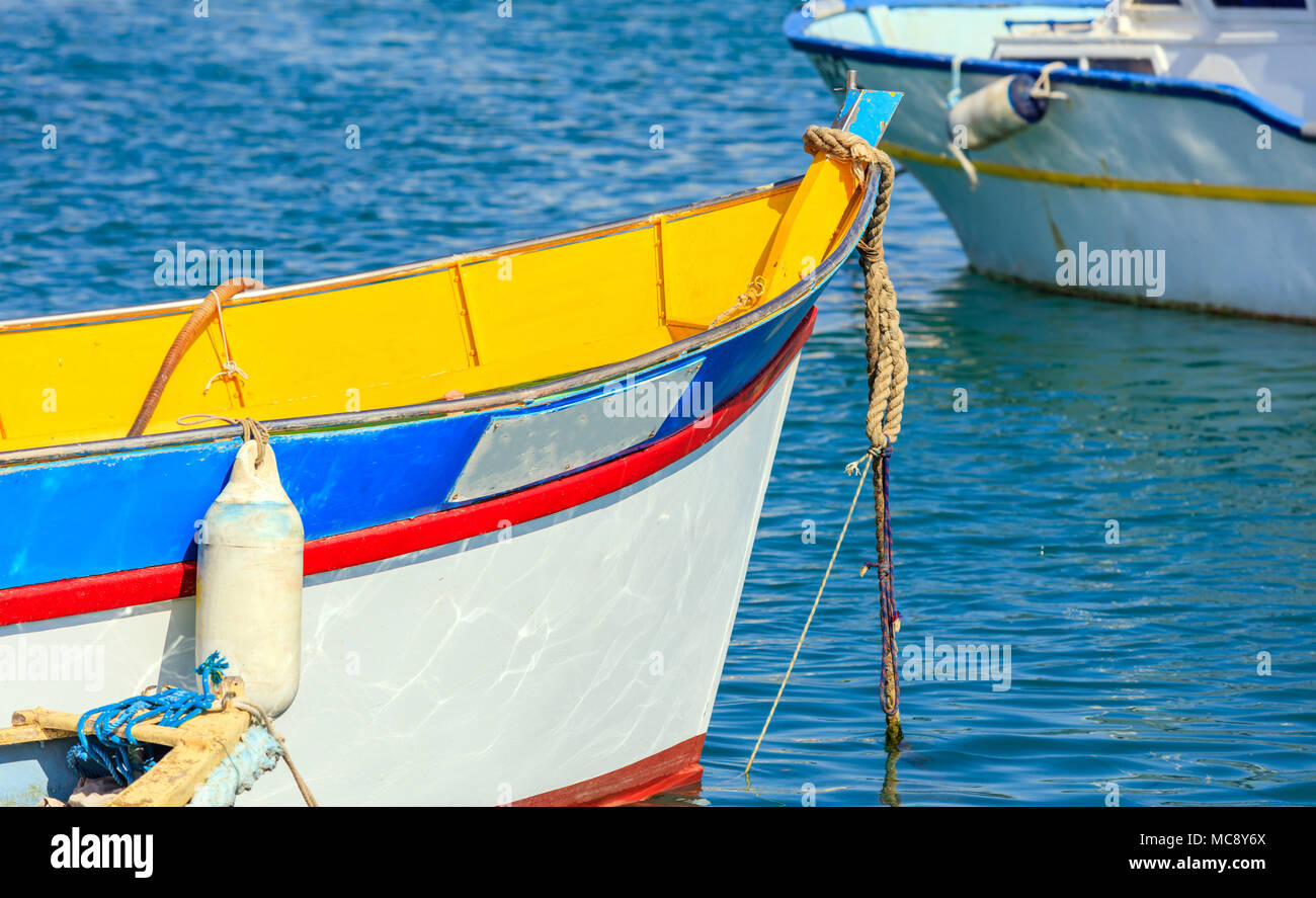 Traditional colorful boat luzzu detail at the port of Marsaxlokk, Malta ...