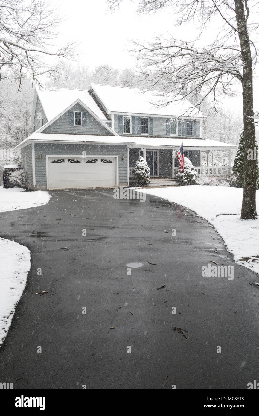 Luxury Suburban House in a Snowstorm, MA, USA Stock Photo