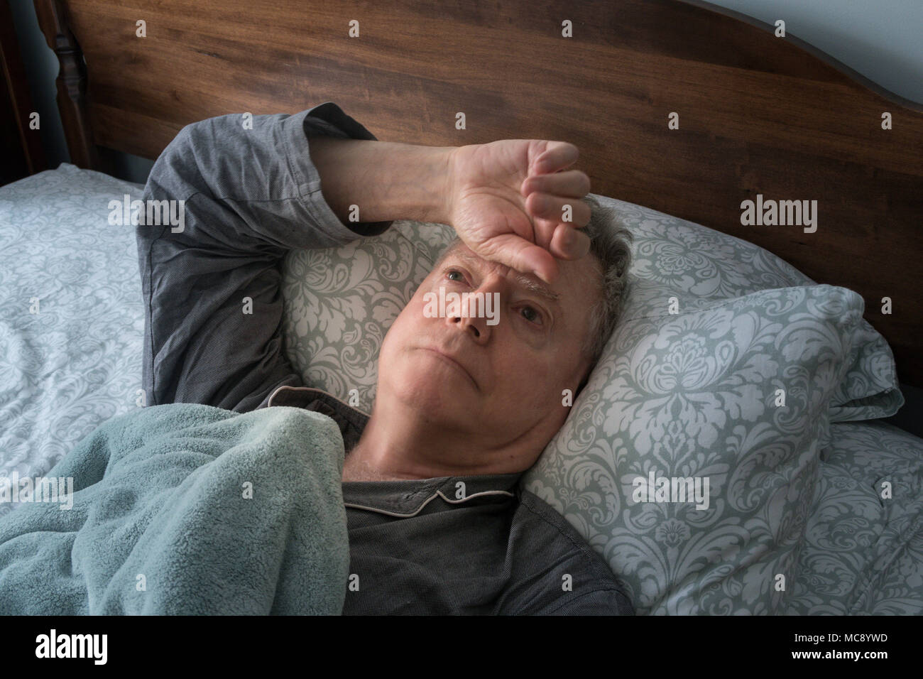 Senior Man Wide awake Worrying in Bed, USA Stock Photo