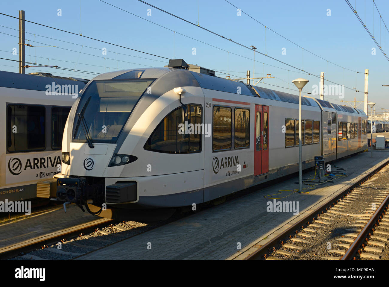 A modern electric multiple unit train parked ready for use at Venlo station in the Netherlands Stock Photo