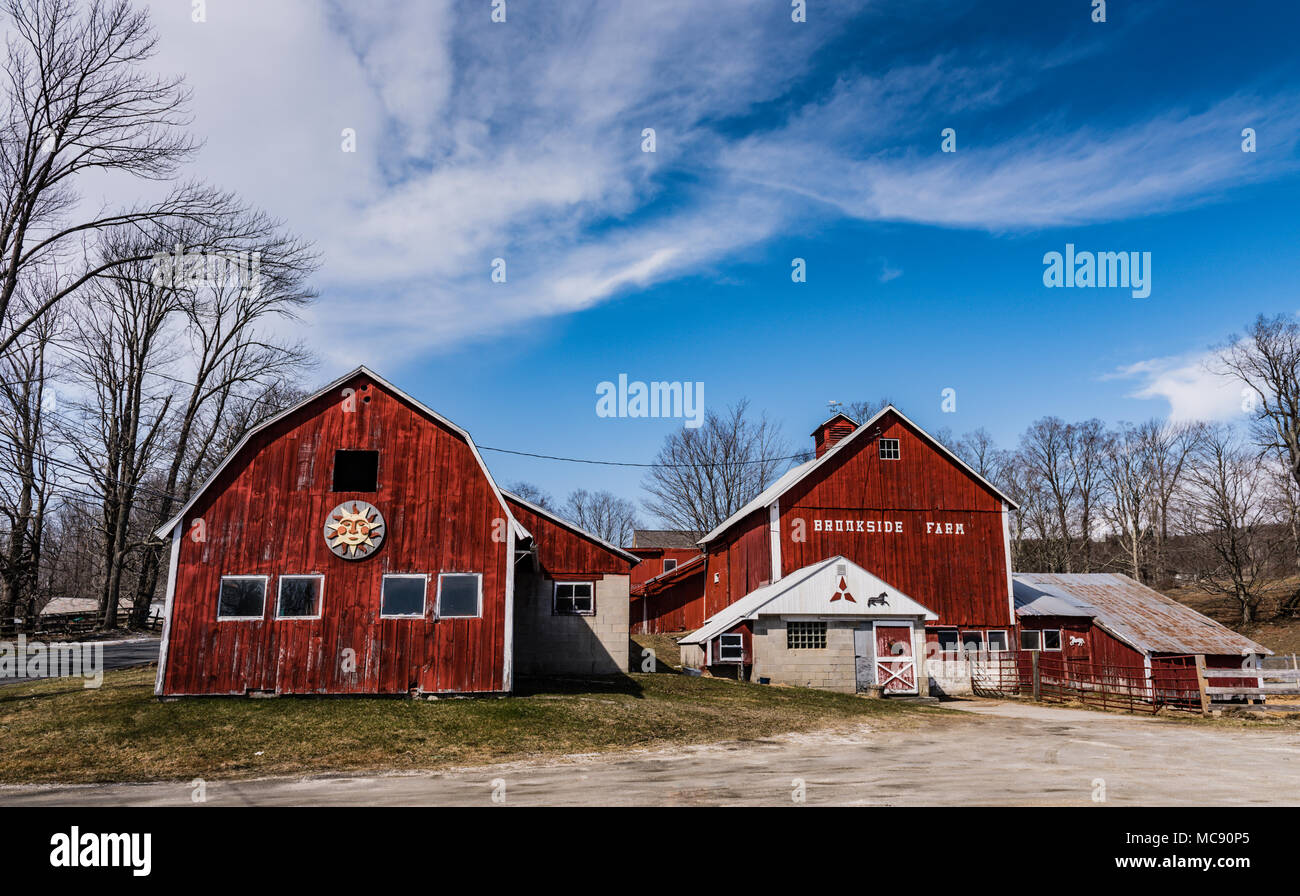 Classic New England scene of red barns on hillside in Lanesboro, MA. Stock Photo