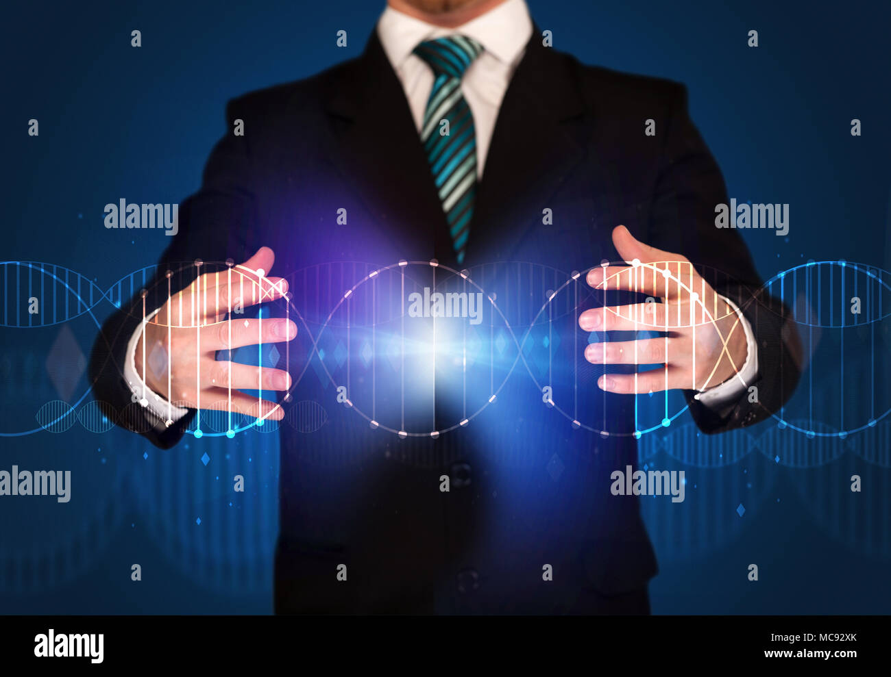 Businessman with DNA concept in his hands Stock Photo - Alamy