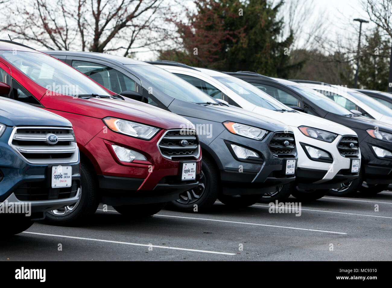 A row of new Ford Escape SUV vehicles at a car dealership in Columbia, Maryland on April 13, 2018. Stock Photo