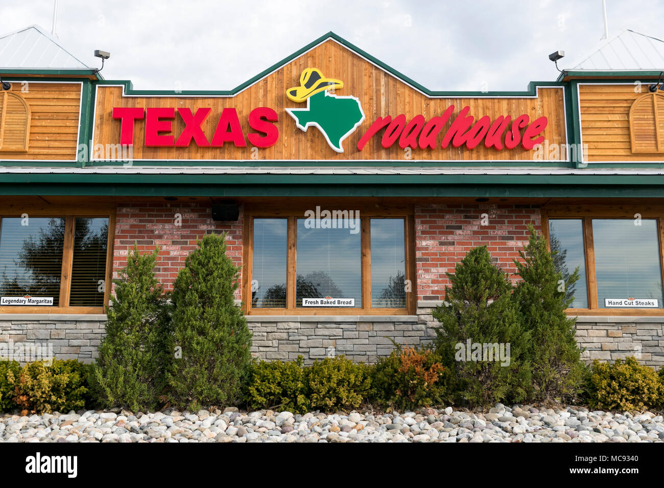 A logo sign outside of a Texas Roadhouse restaurant location in Columbia, Maryland on April 13, 2018. Stock Photo