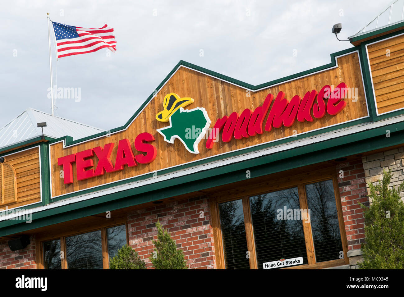 A logo sign outside of a Texas Roadhouse restaurant location in Columbia, Maryland on April 13, 2018. Stock Photo