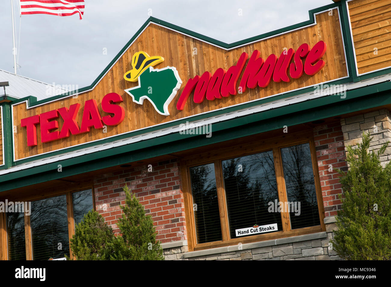 A logo sign outside of a Texas Roadhouse restaurant location in Columbia, Maryland on April 13, 2018. Stock Photo