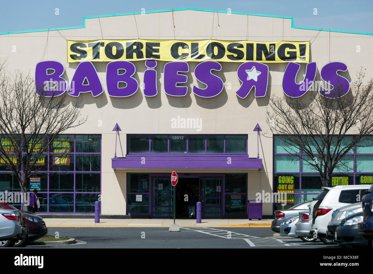 A logo sign outside of a Babies 'R' Us retail store in Silver Spring, Maryland with 'Store Closing' signage on April 13, 2018. Stock Photo