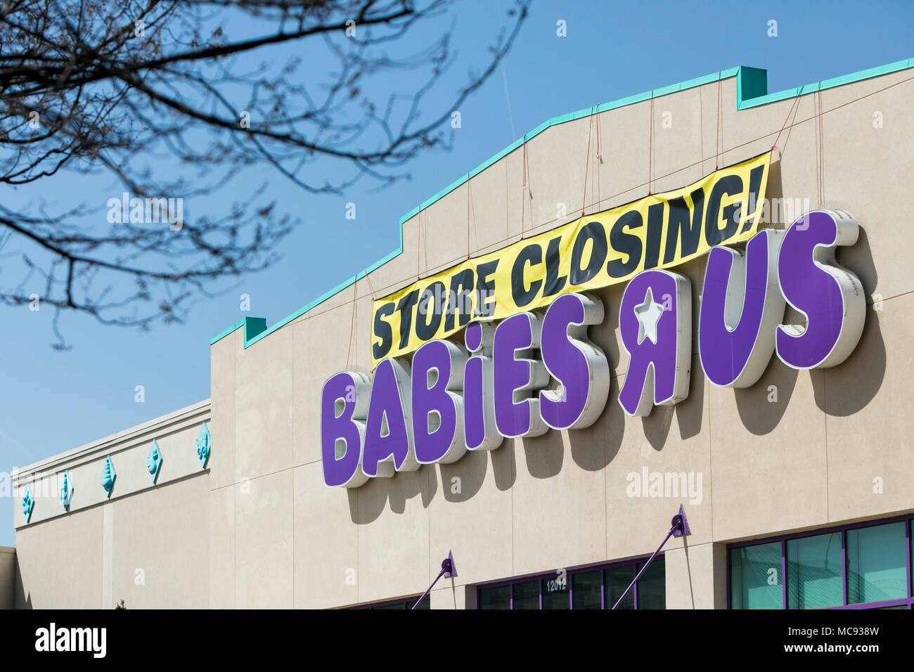 A logo sign outside of a Babies 'R' Us retail store in Silver Spring, Maryland with 'Store Closing' signage on April 13, 2018. Stock Photo
