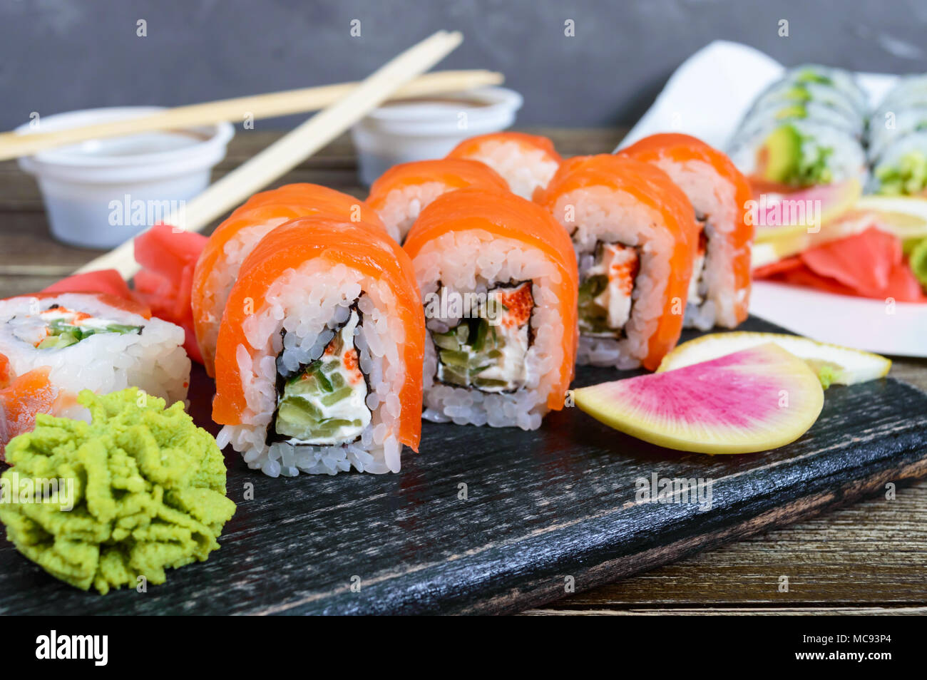 Various kinds of sushi served on wooden background. Sushi menu. Japanese food. Sushi set. Stock Photo