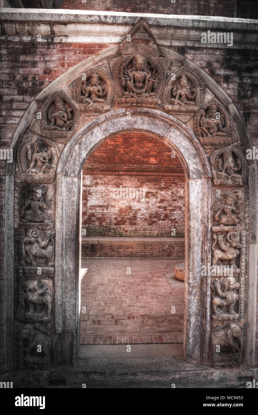 ancient doors of Nepal carved from stone and wood Stock Photo
