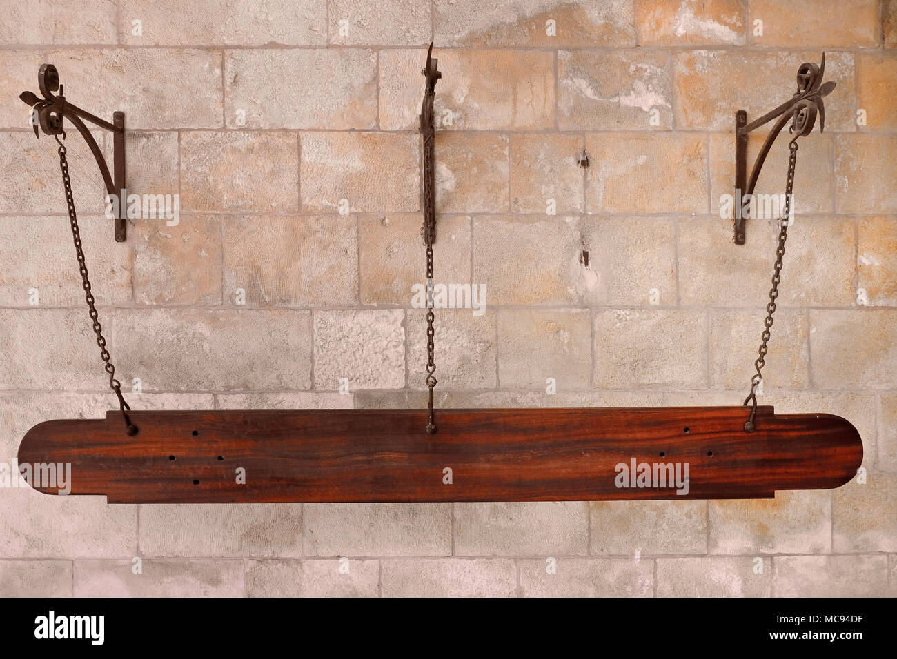 A wooden "Nakos" which is the Arabic name of the Semandron or semantron a  percussion instrument used to call worshipers to prayers placed outside the  Cathedral of Saint James a 12th-century Armenian