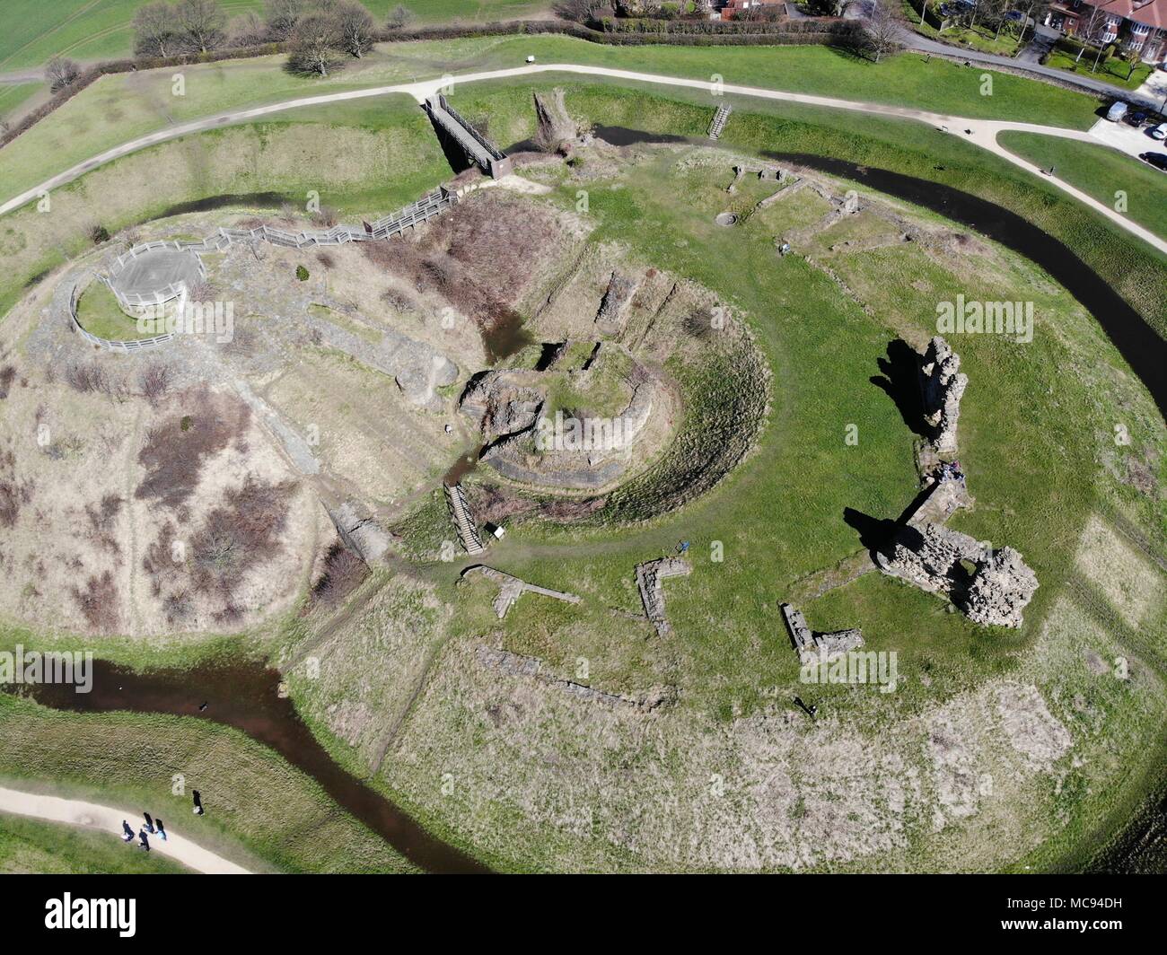 Aerial photos of Sandel Castle in Wakefield in the UK, the ruins of the castle have a moat around the castle grounds, it's also covered in green grass Stock Photo