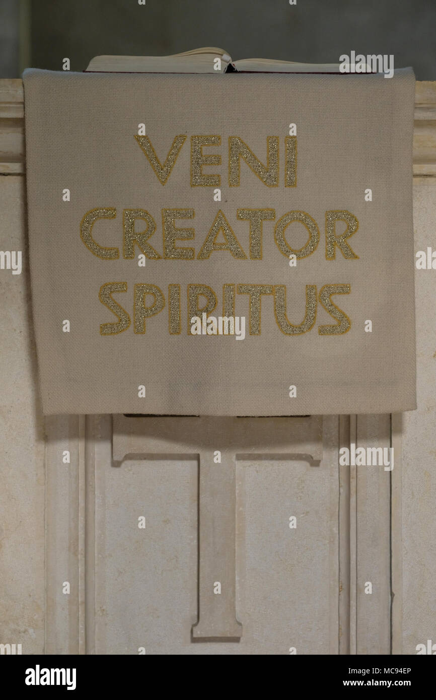 A piece of cloth bearing the sentence of the religious Latin hymn 'Veni Creator Spiritus' ('Come Creator Spirit') which is sung in the Roman Catholic Church during liturgical celebrations on the feast of Pentecost at the Lutheran Church of the Redeemer in the Muristan Christian Quarter old city of East Jerusalem Israel Stock Photo