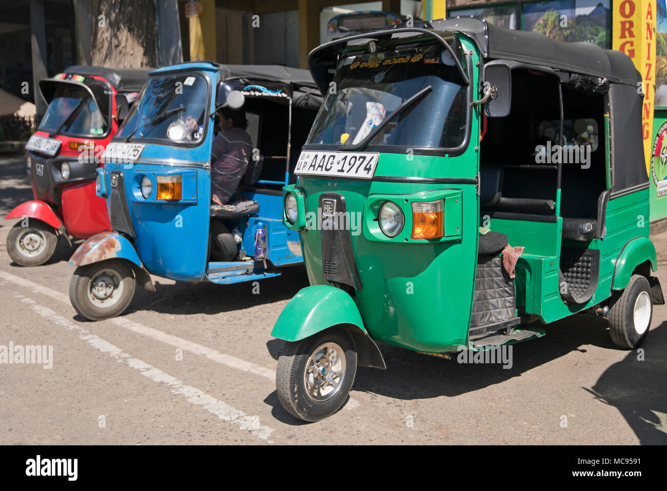 Horizontal view of auto rickshaws parked up in Nuwara Eliya, Sri Lanka