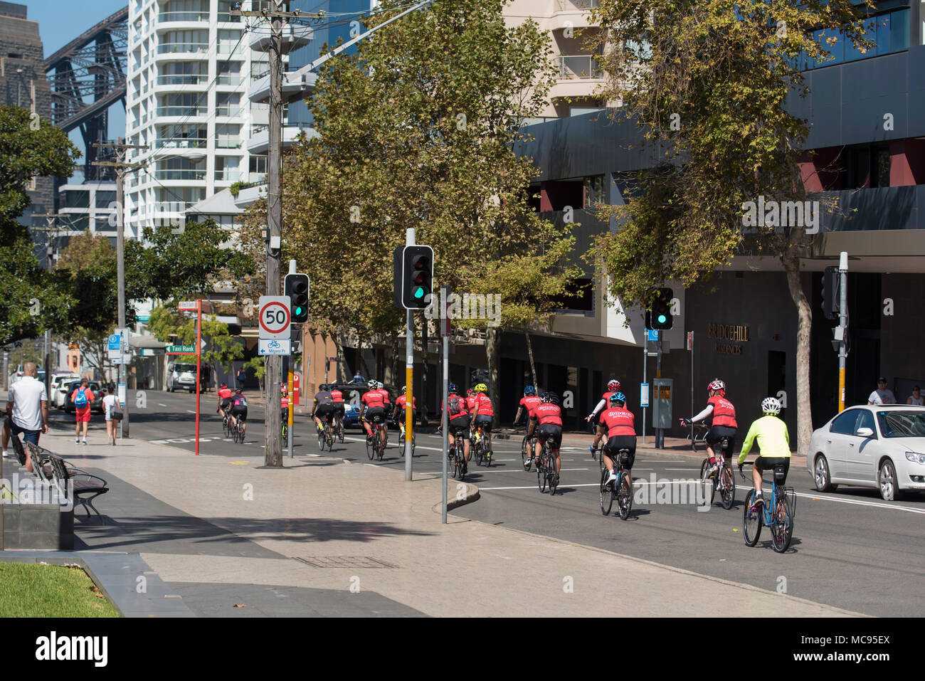 Cyclists riding on Alfred Street, Milsons Point NSW, Australia Stock Photo