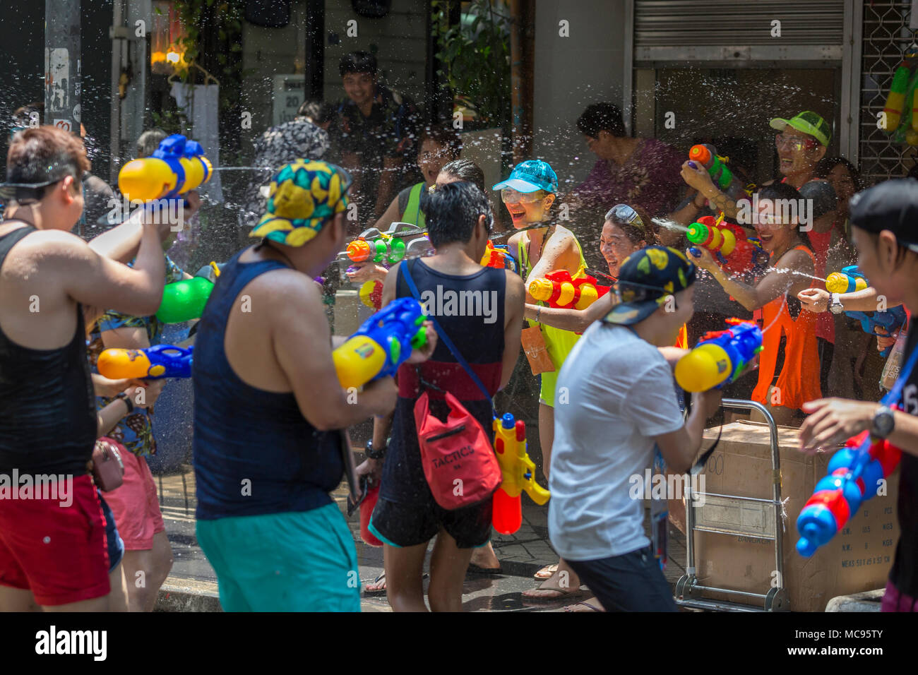 BANGKOK, THAILAND - APRIL 13, 2018: People on the streets of Bangkok during the first day of Songkran Festival, Thai New Year celebrations. Stock Photo