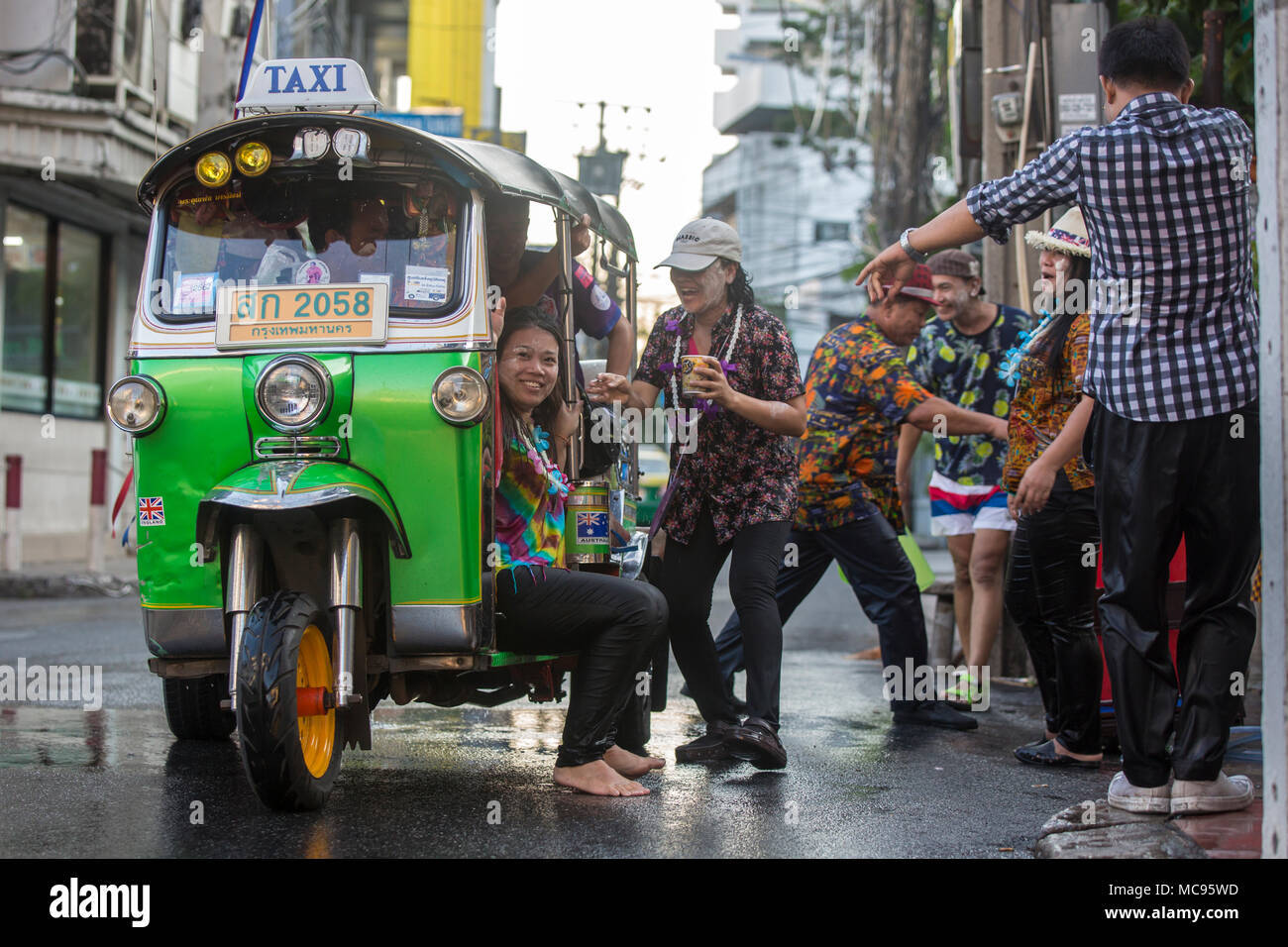 BANGKOK, THAILAND - APRIL 13, 2018: People on the streets of Bangkok during the first day of Songkran Festival, Thai New Year celebrations. Stock Photo