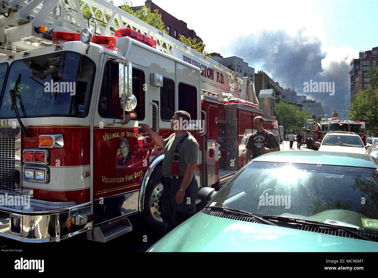 The Irvington Fire Department NYC on duty at the terrorist attack on The World Trade Center New York City on 9/11   photo DON TONGE Photographer Stock Photo