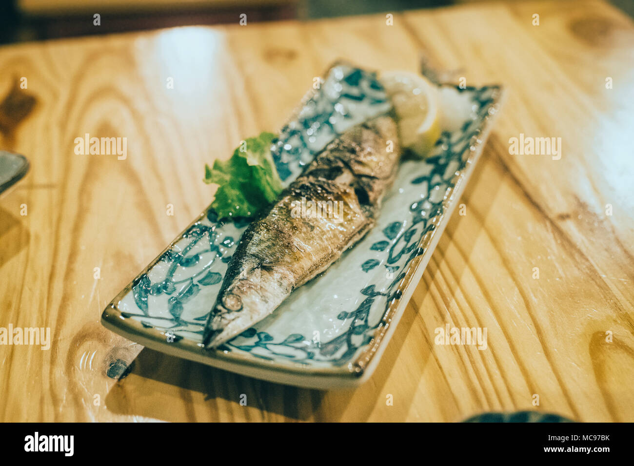 Japanese food in izakaya restaurant at night. Stock Photo