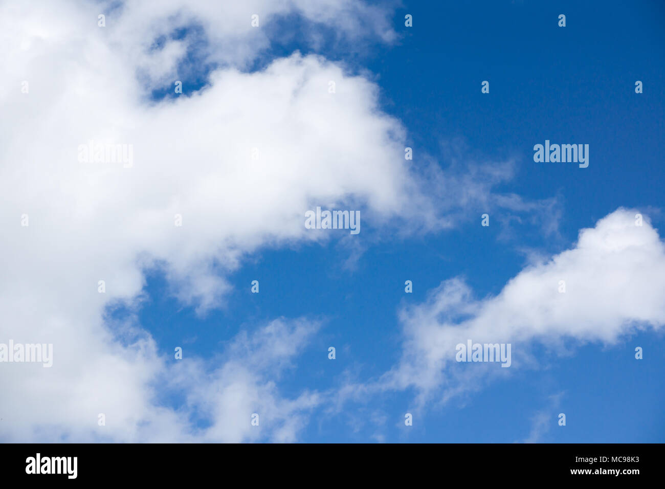 Blue sky with lots of white clouds Stock Photo - Alamy