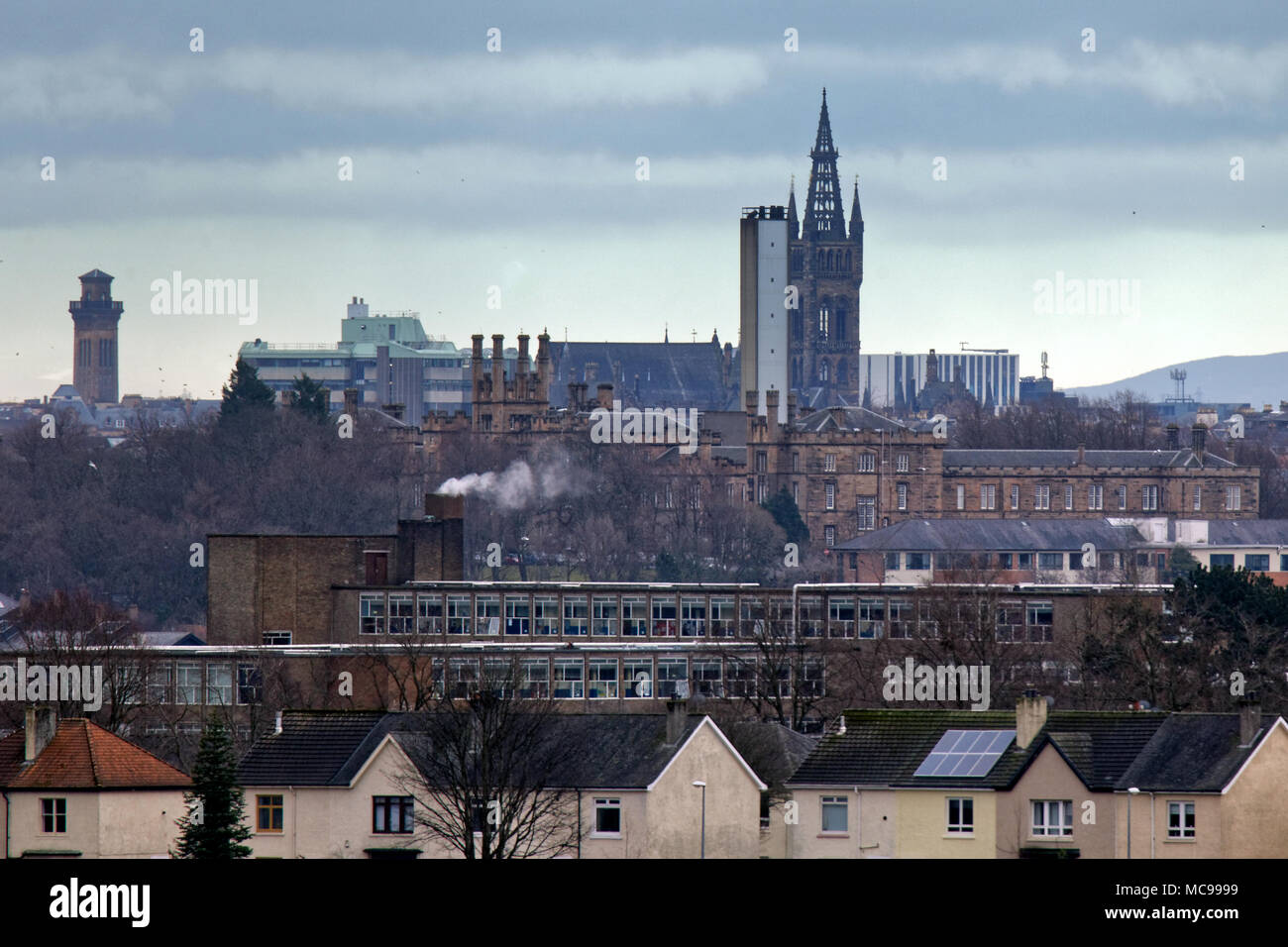 The university of Glasgow clock tower with gartnaval hospital and knightswood secondary school in a compressed view of Glasgow's west end. Stock Photo