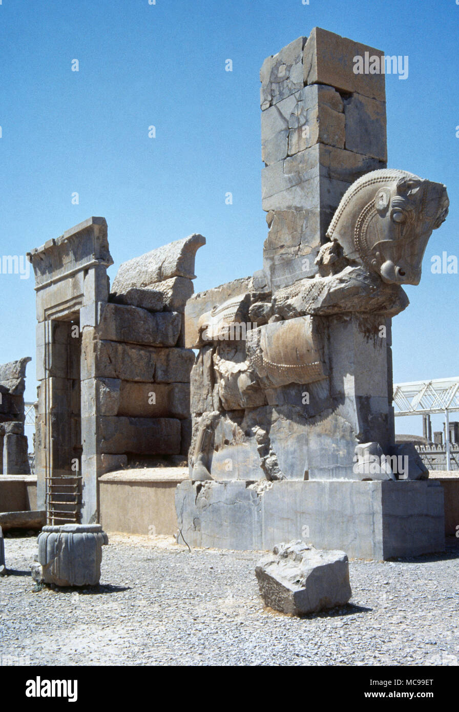 ºPersepolis , capital of ancient Achaemenid Empire, founded by Darius I (522-486 BC). Palace of 100 Columns. It was started by Xerxes I (486-465 BC) ) and finished by Artaxerxes I (465-424 BC). Column shaped like a bull at the northern gate entrance, 5th century BC. Islamic Republic of Iran. Stock Photo