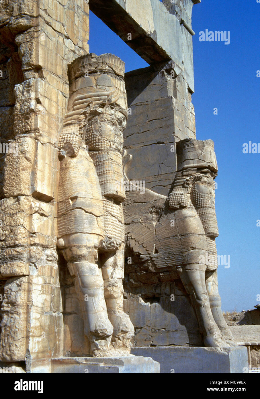 Ancient city of Persepolis. Gate of All Nations or The Gate of Xerxes. Its construction was ordered by Achaemenid king Xerxes I (486-465 BC). Lamassu in the Assyrian style. Fars province. Islamic Republic of Iran. Stock Photo