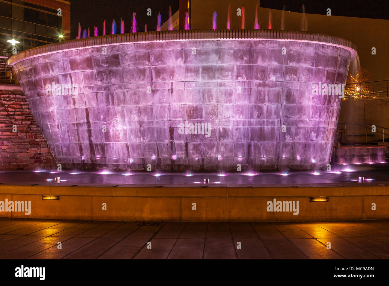 Colored lights display at the Waterwall and fountain by the Woodlands Waterway Stock Photo Alamy