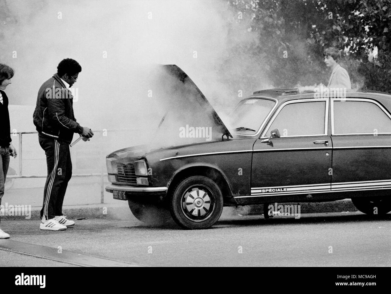 AJAXNETPHOTO. 1982. ROUEN, FRANCE. - PEUGEOT CAR FIRE IN THE CITY.  PHOTO:JONATHAN EASTLAND/AJAX REF:1982 107 Stock Photo