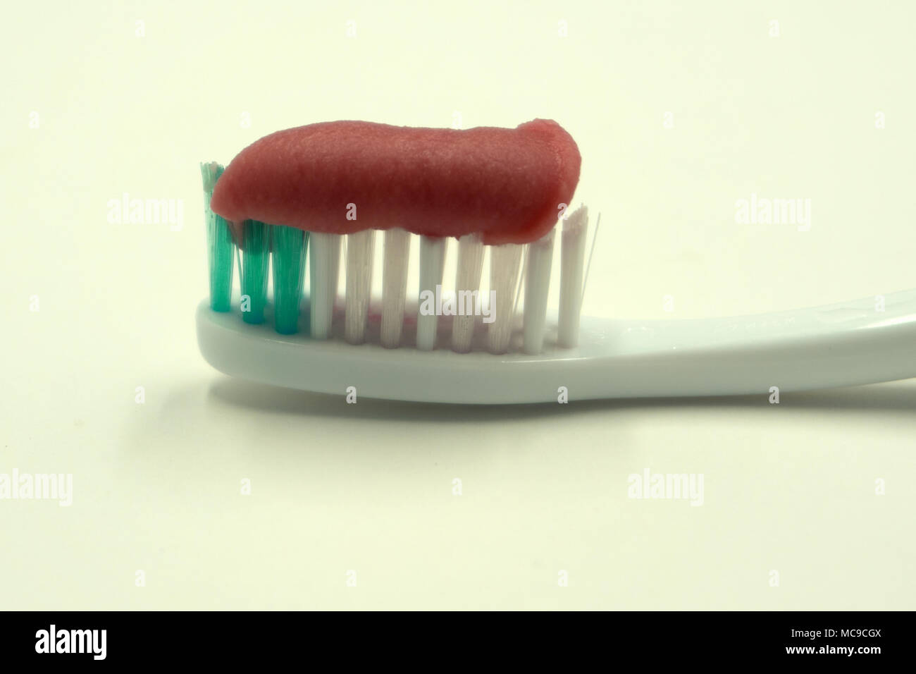 toothpaste toothbrush isolated single striped studio white Stock Photo