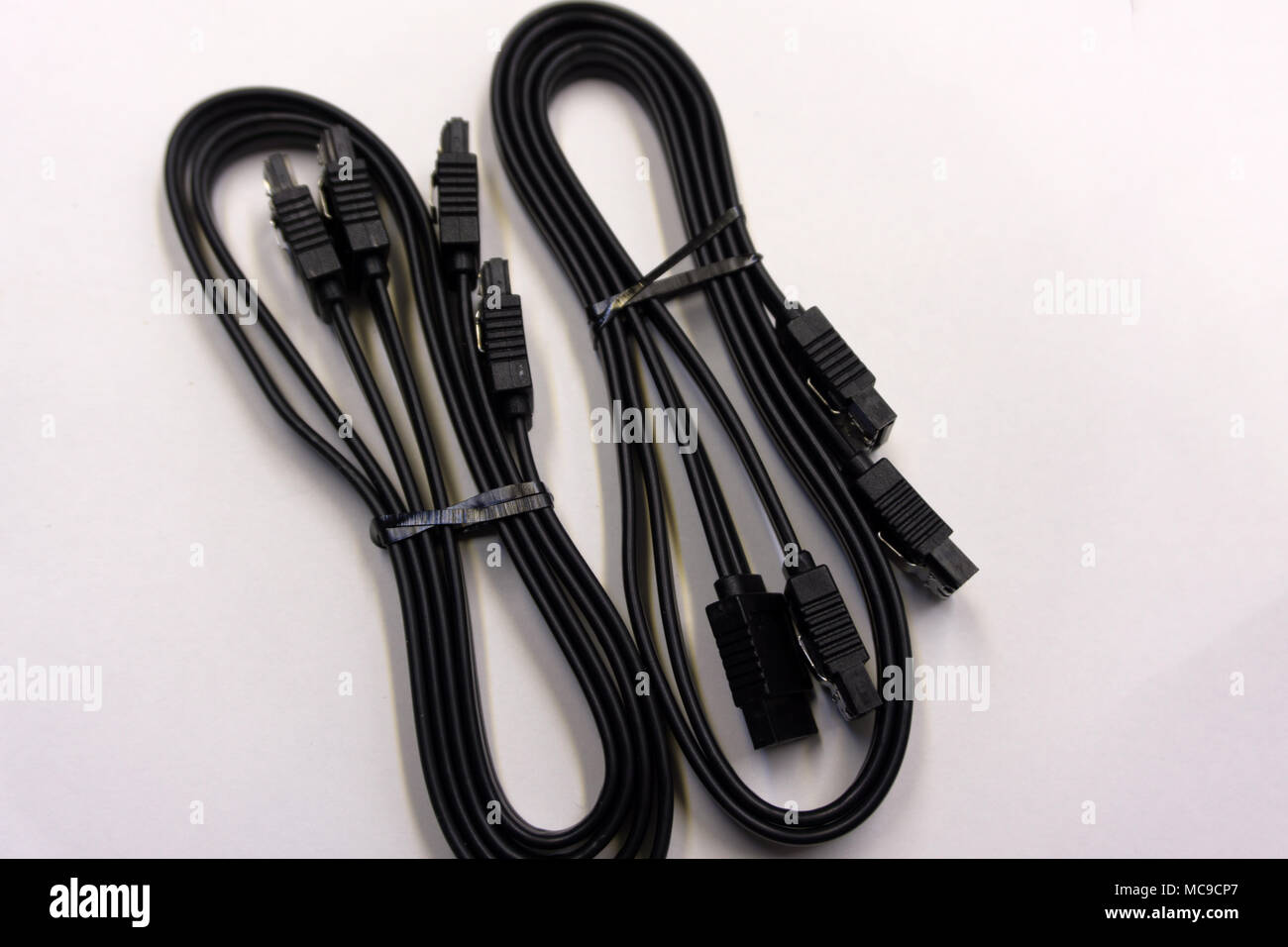 Black SATA cable for connecting a hard drive to the motherboard on a