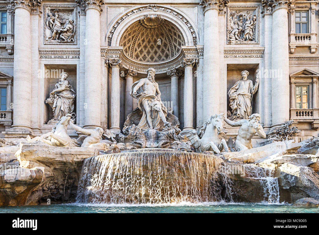 Trevi Fountain in Rome, Italy. Famous landmark fountain di Trevi close up front view of facade and statues.Rome baroque architecture and landmark. Stock Photo