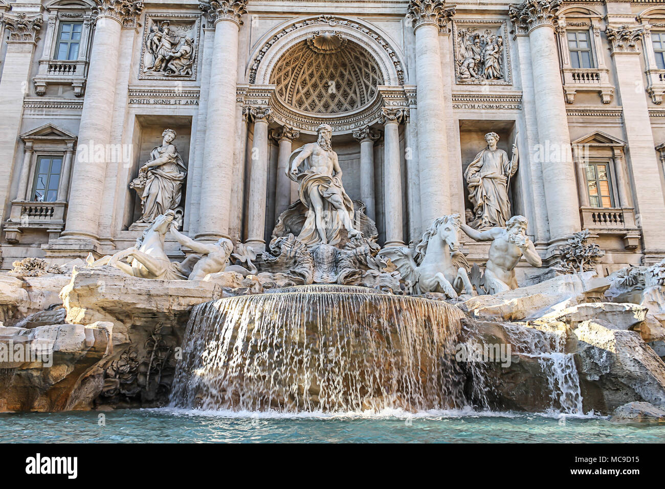 Trevi Fountain in Rome, Italy. Famous landmark fountain di Trevi close up front view of facade and statues. Stock Photo