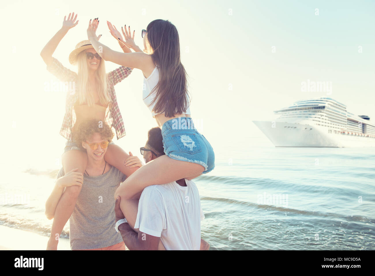 Happy smiling couples who travel by cruiseship. Concept of holiday and summertime Stock Photo
